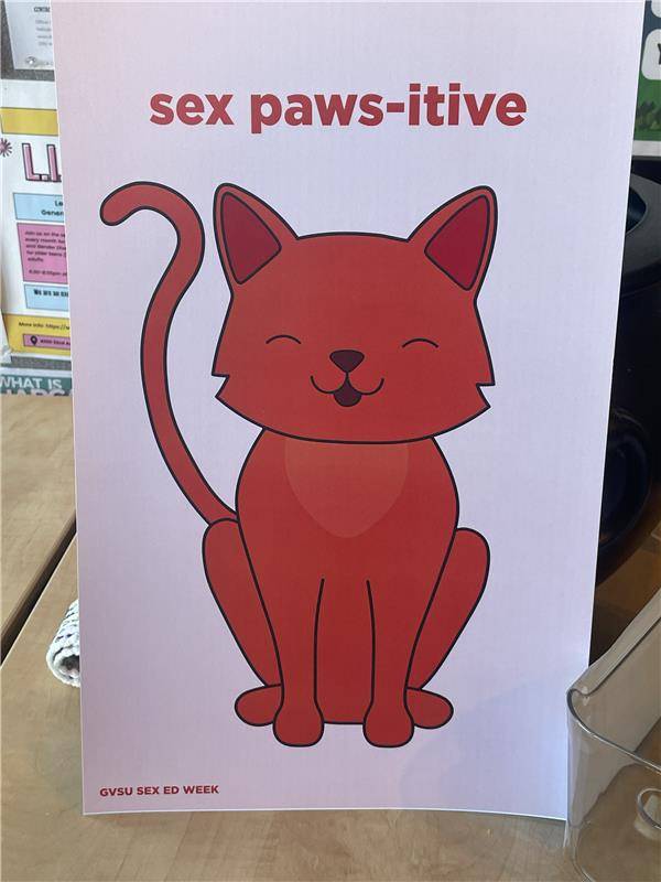 Image of a poster with a cat on it that says "sex paws-itive"